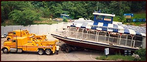 2 Tow Trucks Extracting a Huge Boat
