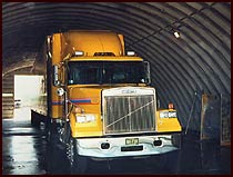 Truck inside the wash bay getting cleaned
